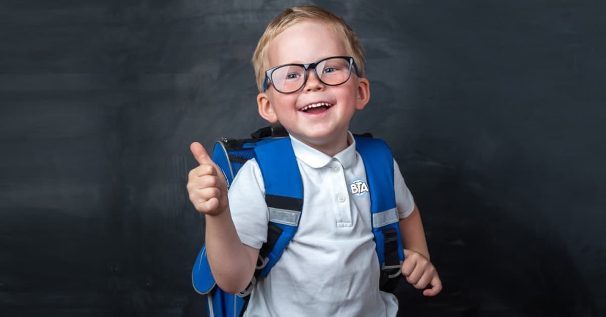 a young boy wearing a blue shirt