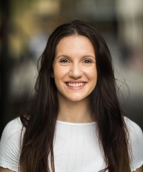 a woman smiling for the camera
