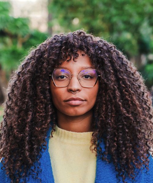 a close up of a woman wearing glasses