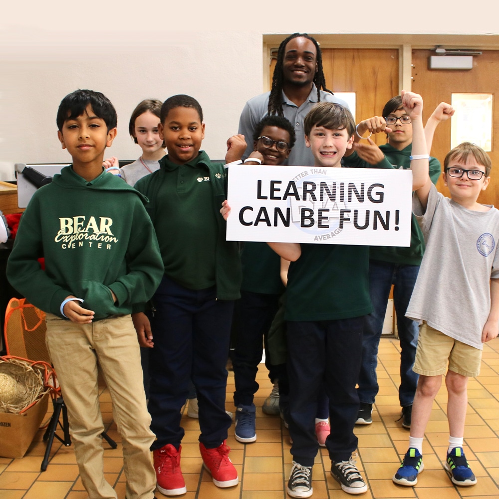 Leon Thomas III et al. posing for a photo