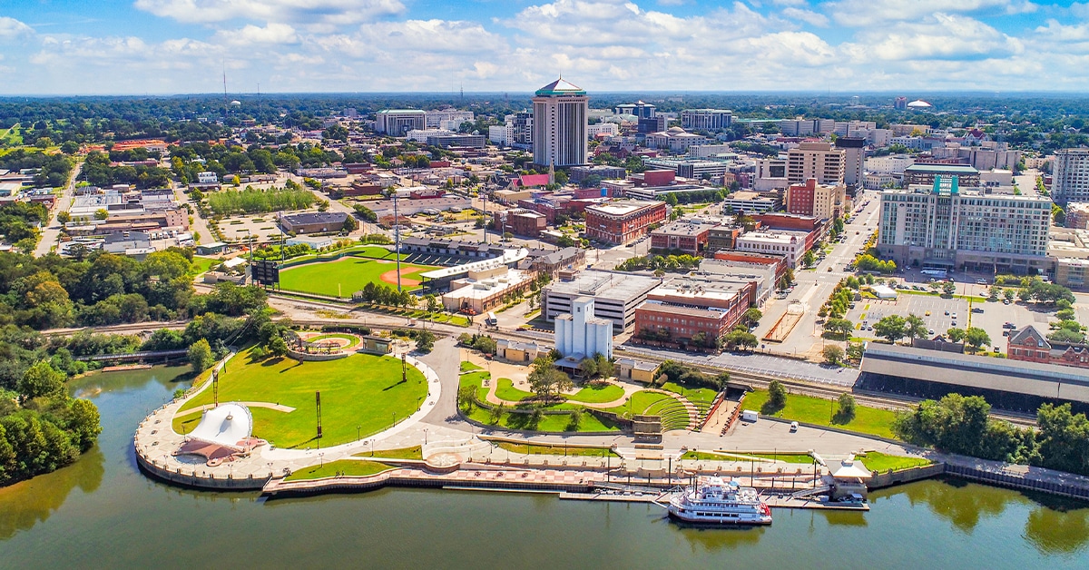 a large body of water with a city in the background