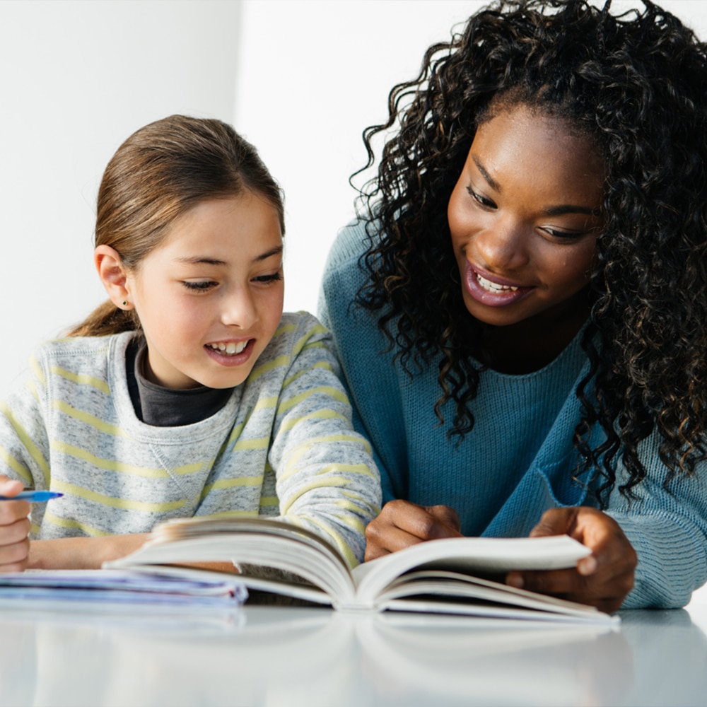 Two students reading a book